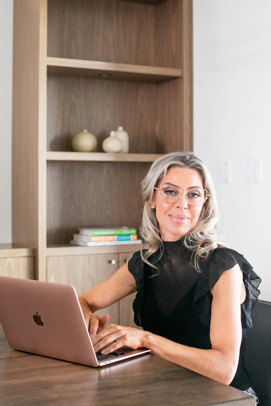 Dr. Jordana Aziz working at a desk with patient education resources