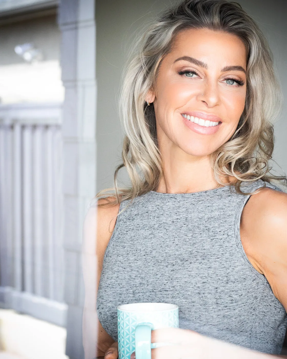 Dr. Jordana Aziz smiling beside a bright window